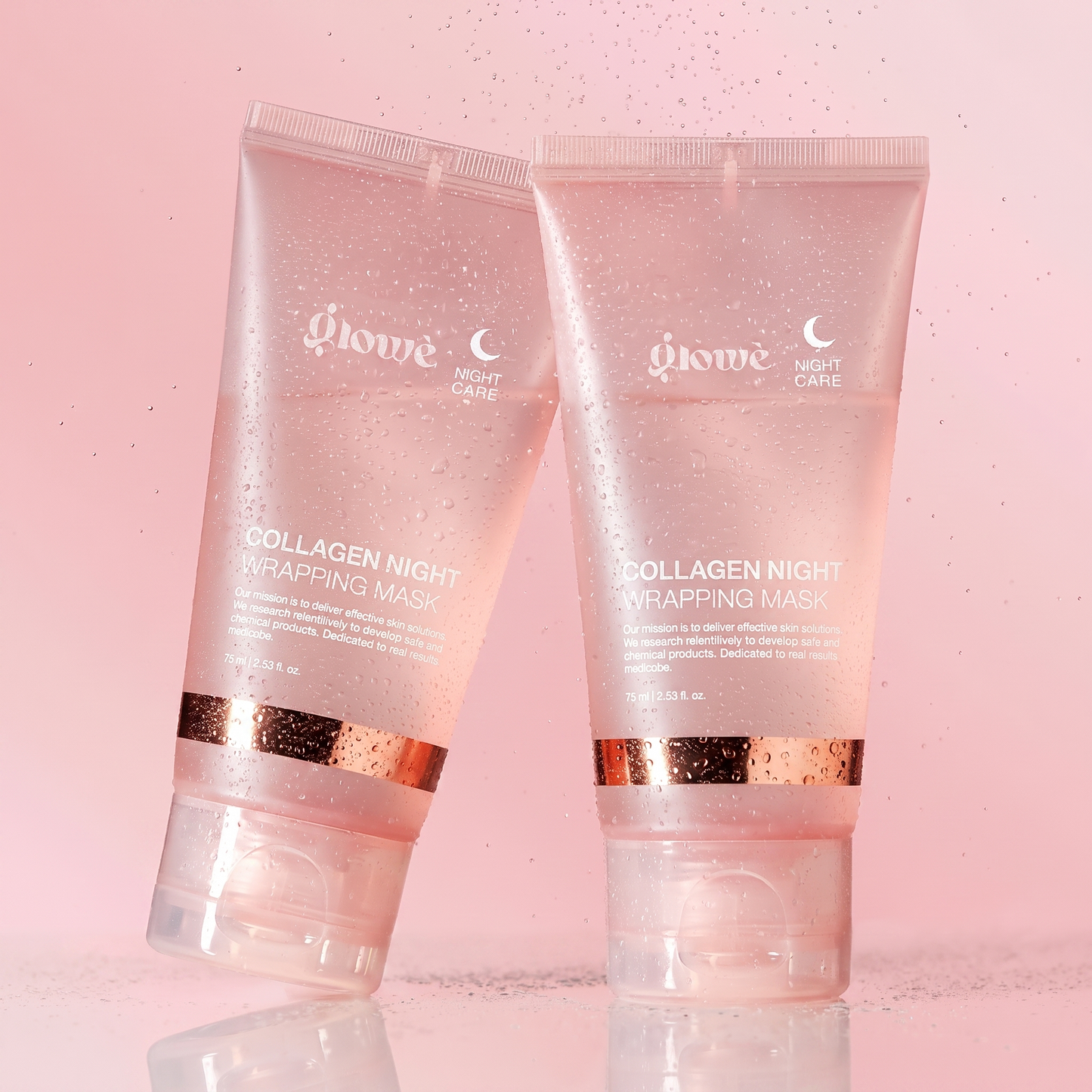 Two Glowé Collagen Night Wrapping Mask tubes with fresh water mist