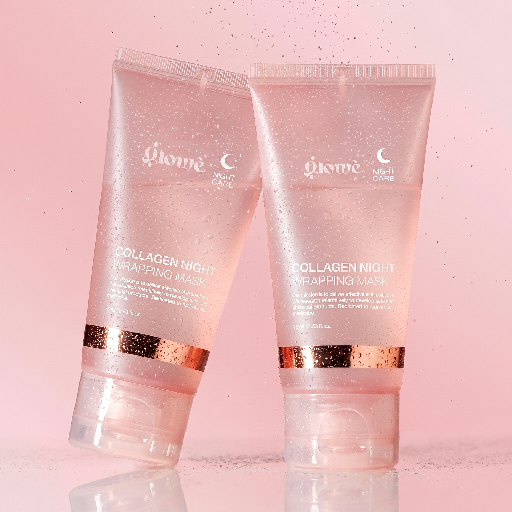 Two Glowé Collagen Night Wrapping Mask tubes with fresh water mist