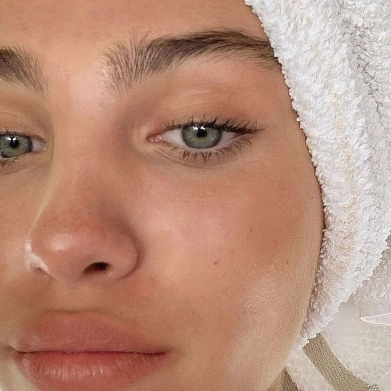 Fresh glowing skin close-up with towel